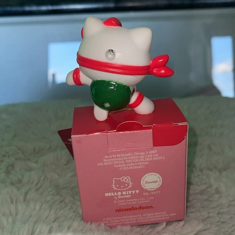 McDonald’s happy meal Sanrio Hello Kitty x Raphael Figure for a game of sorts